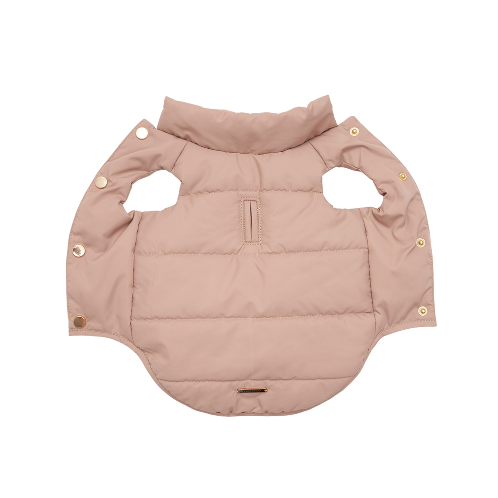 Fully expanded, the protective outer shell showcases its aerodynamic quilting pattern. The beige textile acts as an absolute barrier against snow and freezing moisture for small to medium breeds.