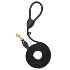Top-down perspective of the stealth black dog walking leash by CacheMio & CHOUCHOÚ, featuring a tightly coiled dark rope and supple leather grip.