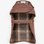 Interior view of the functional dog vest, revealing the traditional tartan plaid cotton lining engineered for optimal thermal retention.