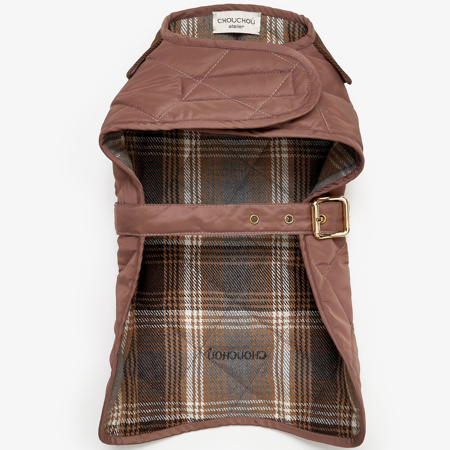 Interior view of the functional dog vest, revealing the traditional tartan plaid cotton lining engineered for optimal thermal retention.