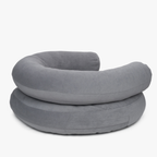 Concealed rear zipper lines maintain the pristine minimalist silhouette of the folded grey orthopedic resting space by CacheMio.