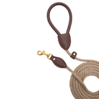 Aesthetic flatlay of the premium chocolate brown pet lead, highlighting the heritage-inspired design and durable shock-absorbing beige core.