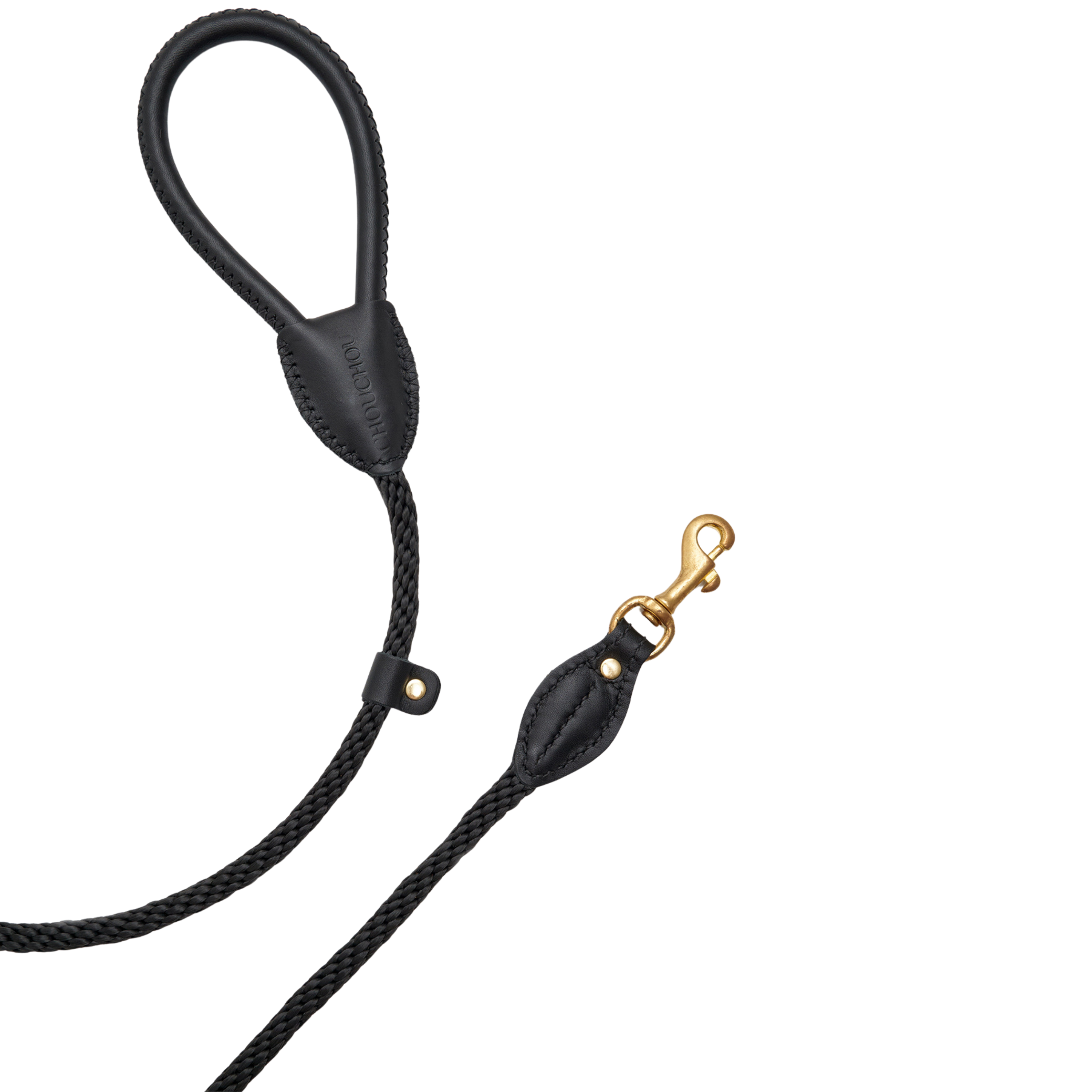 Close-up on the rust-resistant solid brass hardware and meticulous dark stitching on the CacheMio x CHOUCHOÚ urban dog accessory.