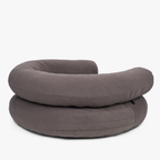 Seamless zipper integration and a stable foam foundation shape the rear profile of this heavy-duty earthy brown canine sofa.