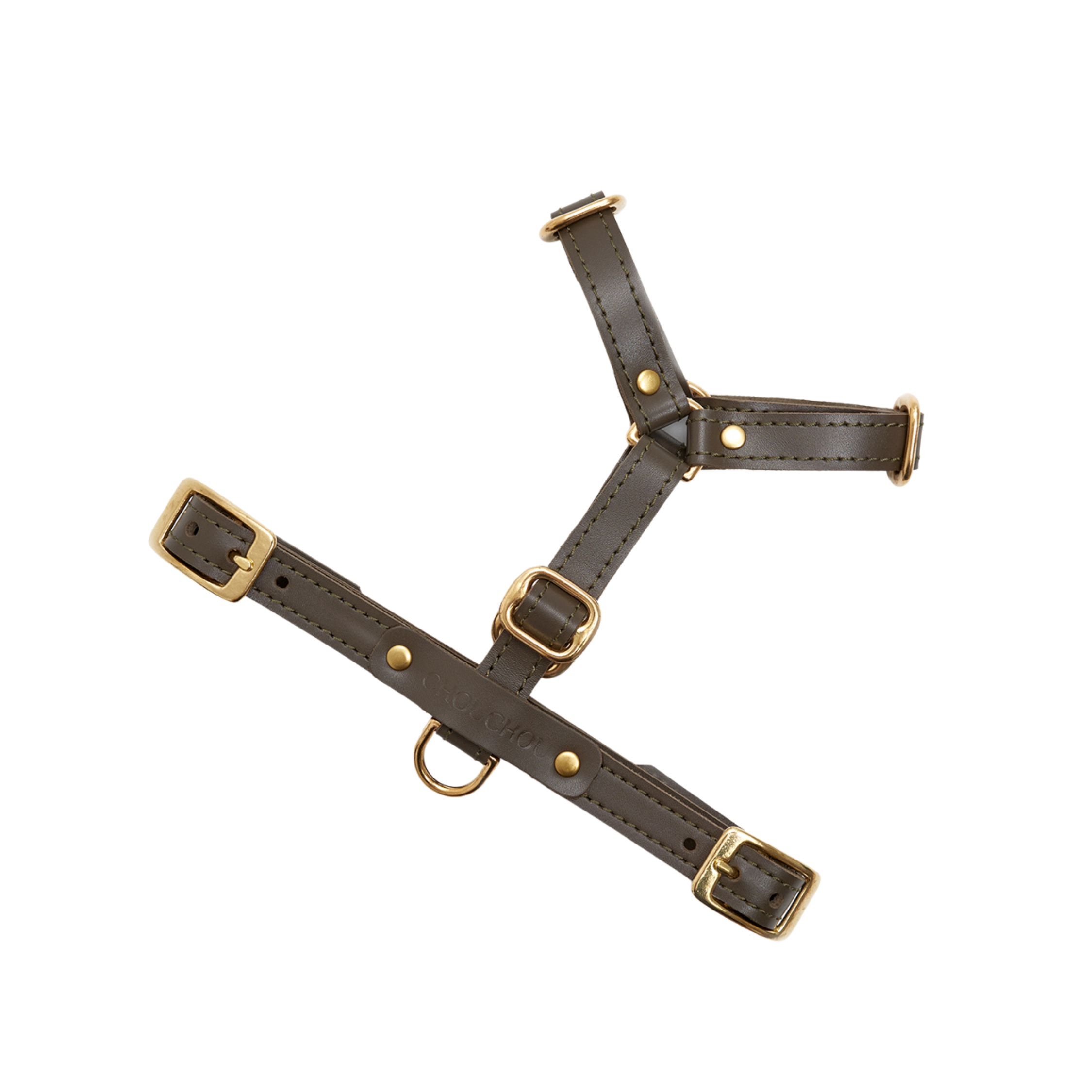 Earthy olive green leather forms a sophisticated Y-shaped walking vest, suspended to reveal its structural integrity and gleaming brass hardware.