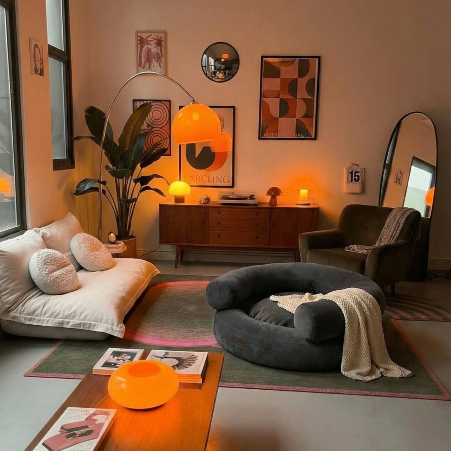 Warm ambient lighting from retro orange lamps illuminates a stylish living space, where the dark orthopedic pet sofa perfectly complements mid-century furniture.