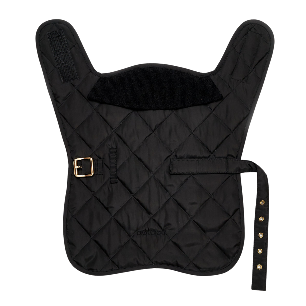 Top-down layout of the minimalist black quilted dog vest, showcasing the dark weather-resistant shell and high-contrast solid brass waist belt.