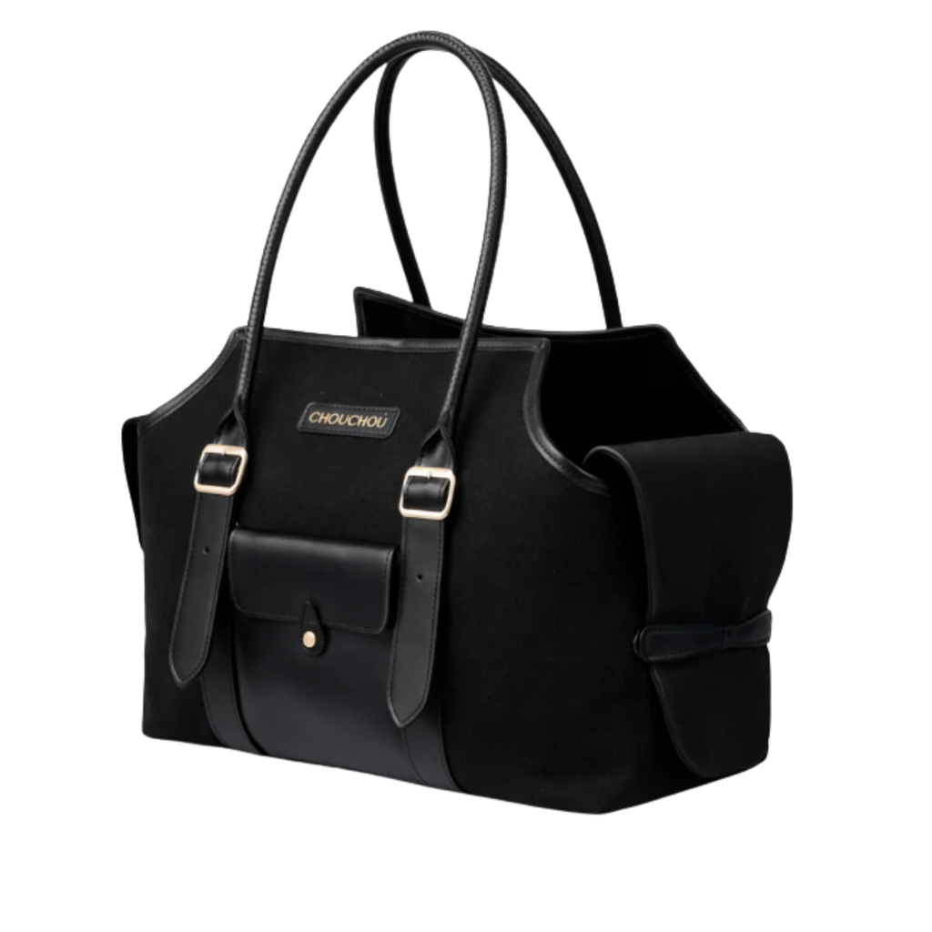 Striking jet black canvas and smooth leather converge to form this metropolitan pet carrier, punctuated by elegant gold-tone brass buckles.