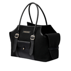 Striking jet black canvas and smooth leather converge to form this metropolitan pet carrier, punctuated by elegant gold-tone brass buckles.
