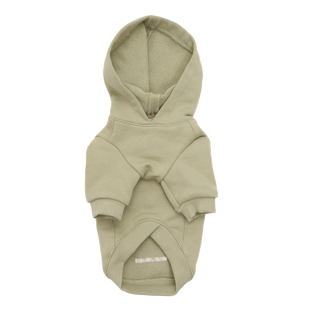 Muted pistachio green cotton shapes the frontal profile of this canine loungewear, highlighting the reinforced collar seam and relaxed chest architecture.