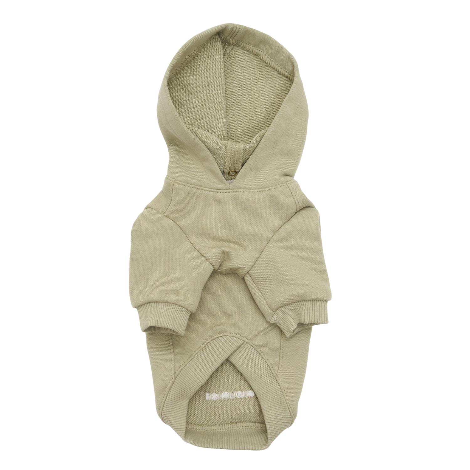 Muted pistachio green cotton shapes the frontal profile of this canine loungewear, highlighting the reinforced collar seam and relaxed chest architecture.