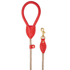 Minimalist flatlay of the Classic Red dog walking leash by CacheMio & CHOUCHOÚ, showcasing its bold design and shock-absorbing beige construction.