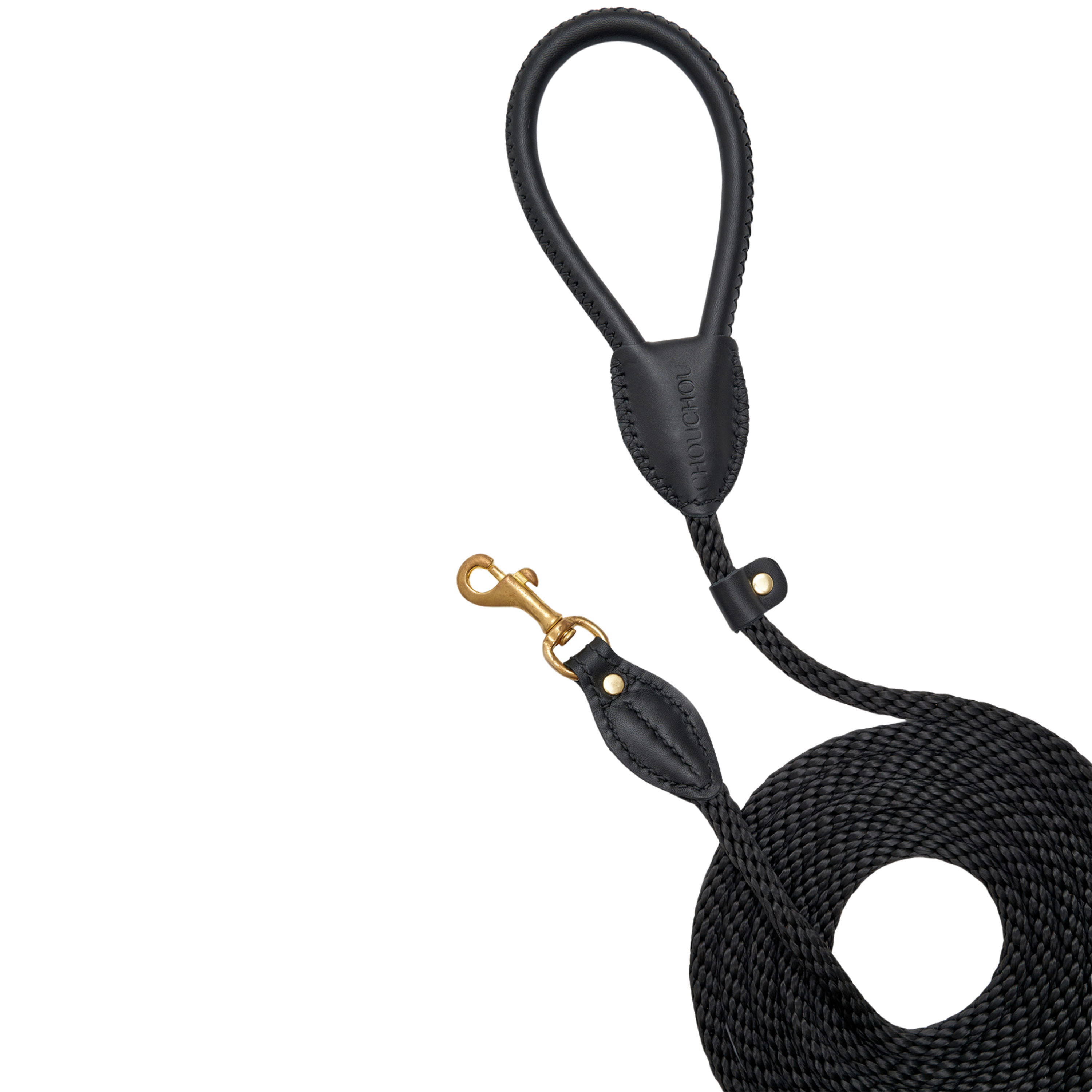 Clean aesthetic flatlay of the premium monochrome black puppy lead, highlighting its heavy-duty shock-absorbing core and sophisticated design.