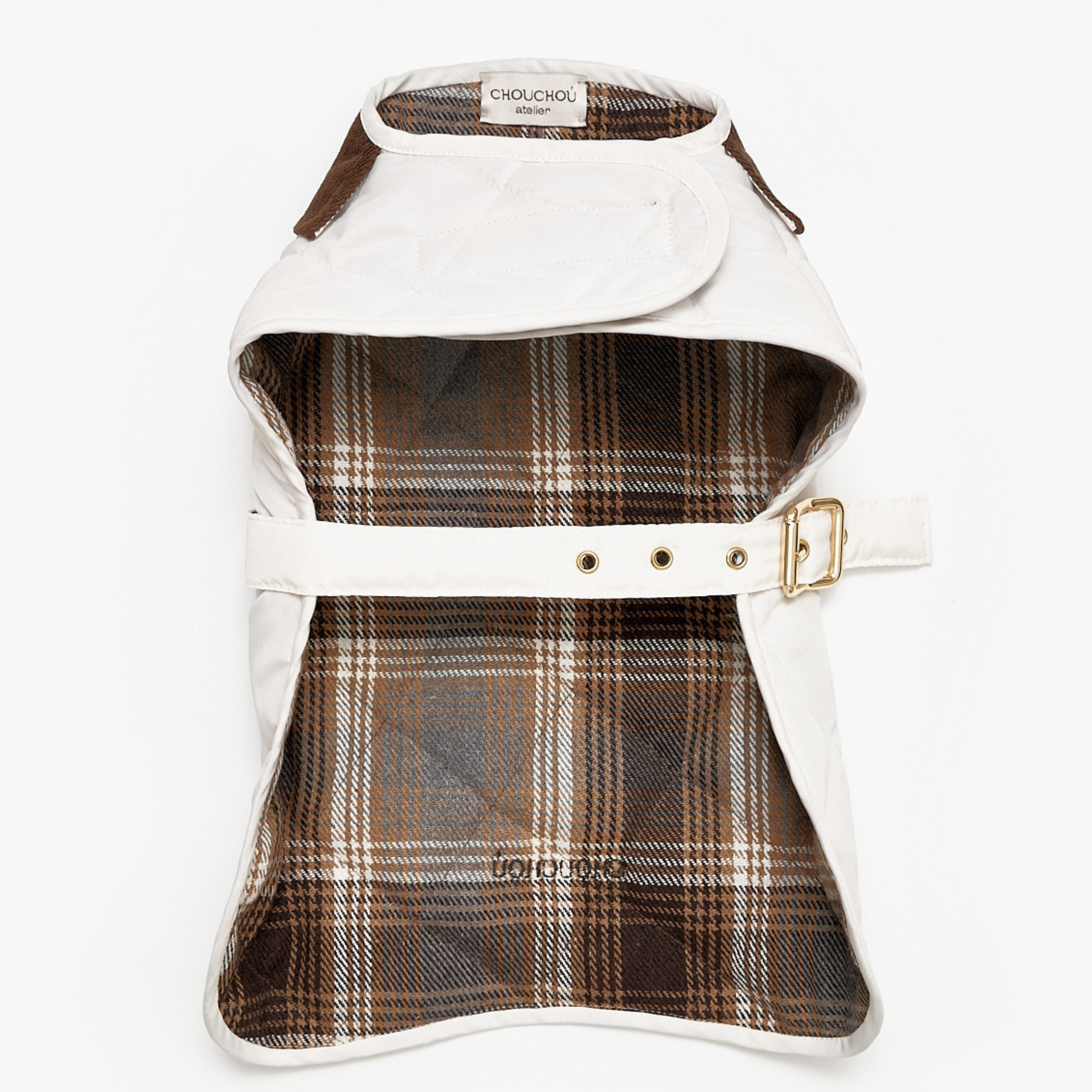 Unfurled to reveal its intricate interior, the garment exposes a classic brown and white plaid cotton lining. This breathable thermal layer is bordered by the pristine, water-resistant outer fabric.