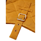 Golden-tone brass hardware securely fastened across a rich yellow water-resistant textile, ensuring absolute durability during active daily walks.
