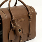 Custom CHOUCHOÚ hardware and a dedicated waste bag cylinder accent the warm earthy tones of this premium vintage-style airline carrier.