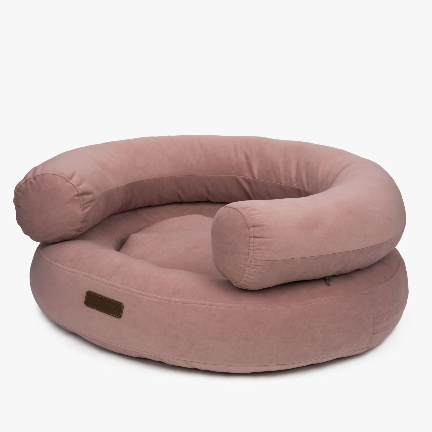 Angled view of the Marshmallow orthopedic dog bed in pink by CHOUCHOÚ, featuring ultra-soft raised bolsters and premium upholstery.