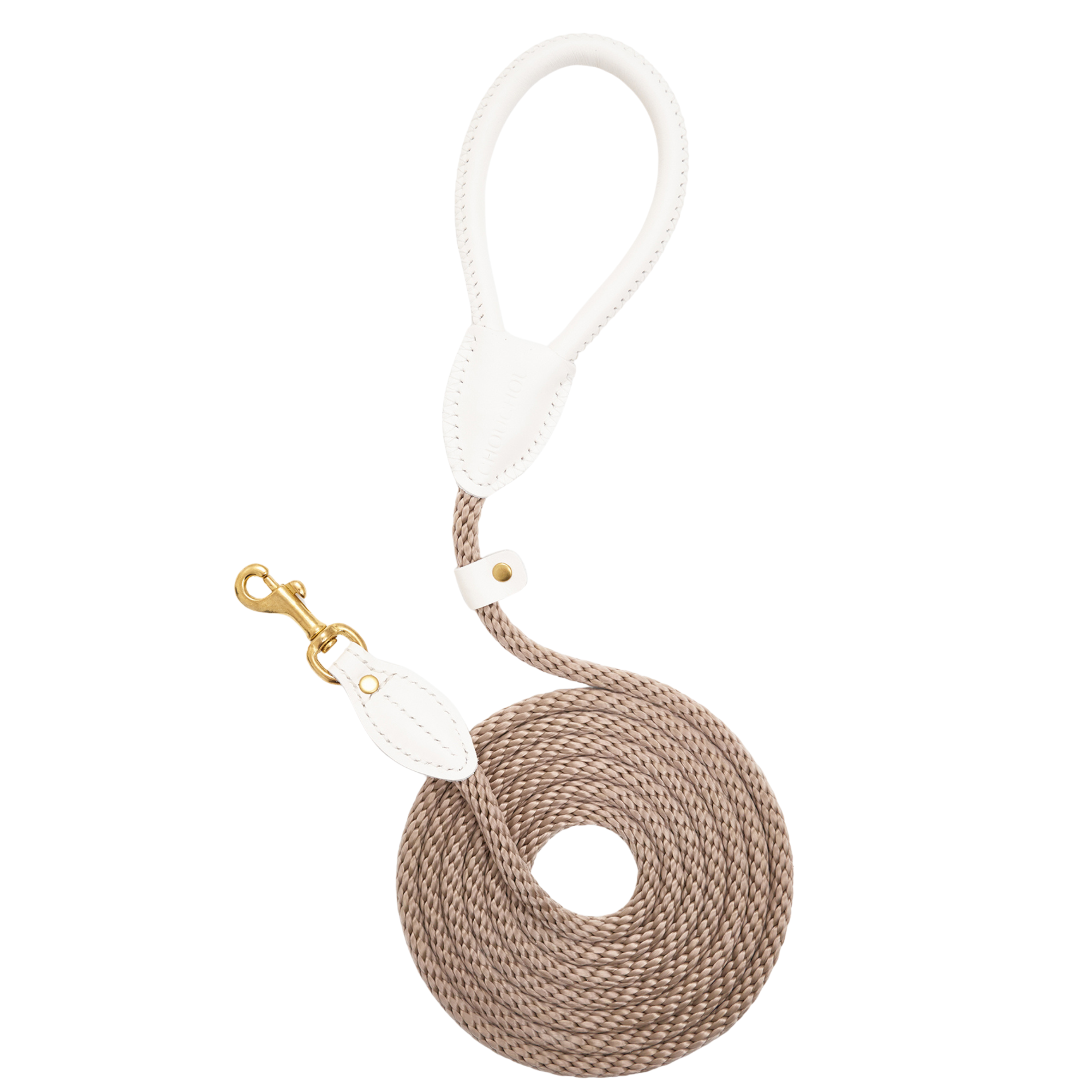 Top-down view of the coiled Classic Red walking leash by CacheMio & CHOUCHOÚ, featuring a bold milk-white leather handle and earthly beige rope.